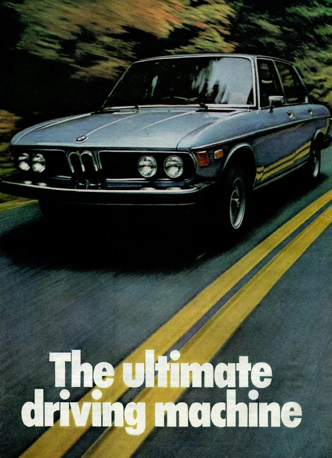 A poster for a BMW car with the 'The Ultimate Driving Machine' tagline